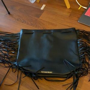 Black back pack with strings on the side